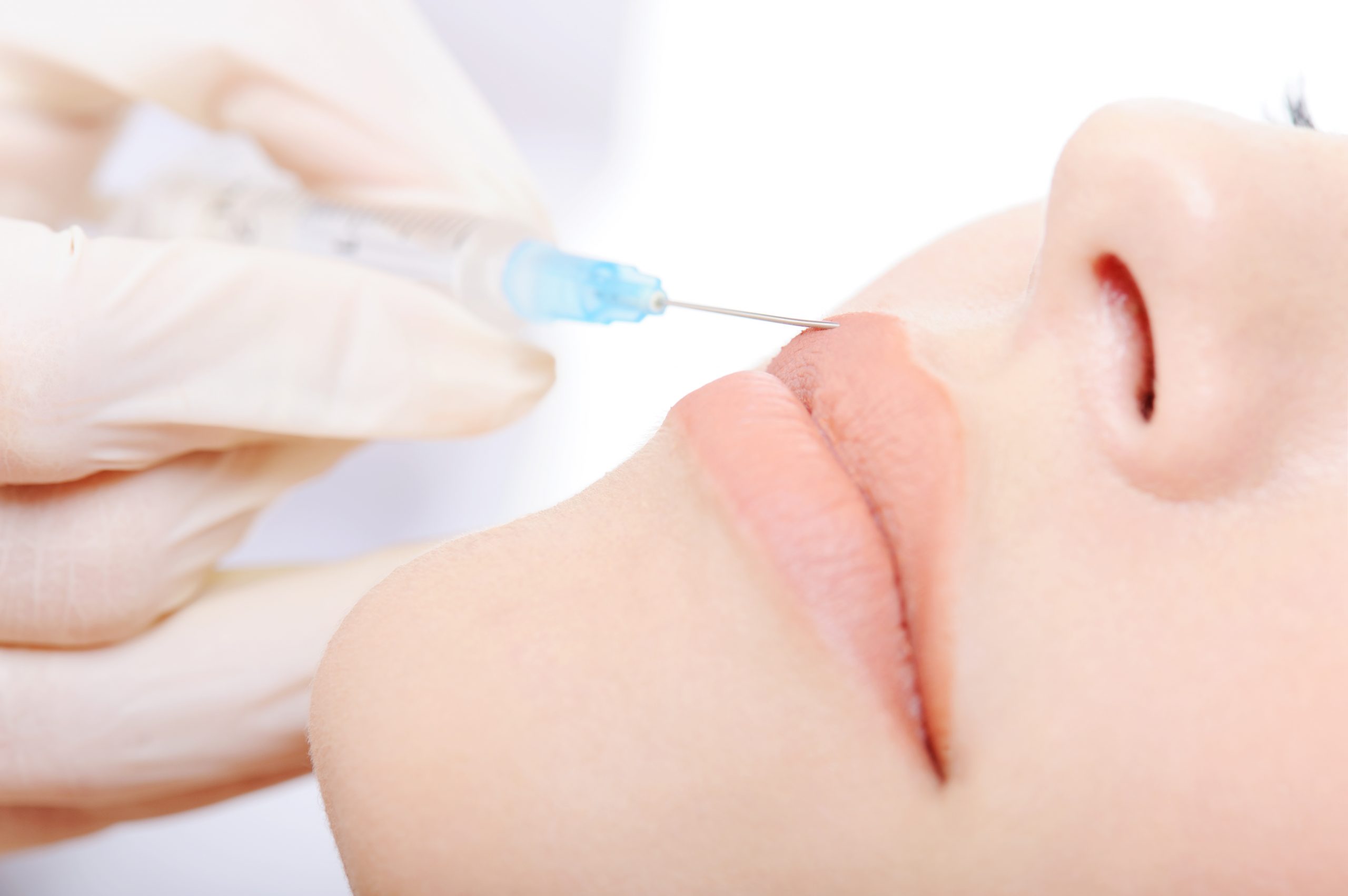 dentist-applying-botox-injection-lips